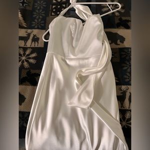 A silk wedding dress, size small. Never worn.